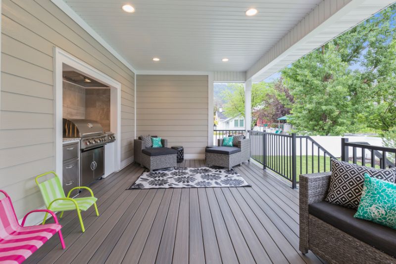 back deck with an outdoor kitchen and lounge area