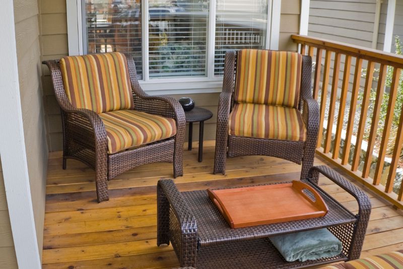hardwood deck with rattan chairs and table